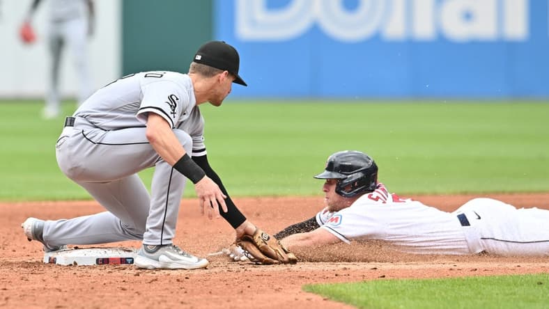Aug 6, 2023; Cleveland, Ohio, USA;  Cleveland Guardians center fielder Myles Straw (7) is caught stealing by Chicago White Sox second baseman Zach Remillard (28) during the third inning at Progressive Field. Mandatory Credit: Ken Blaze-USA TODAY Sports