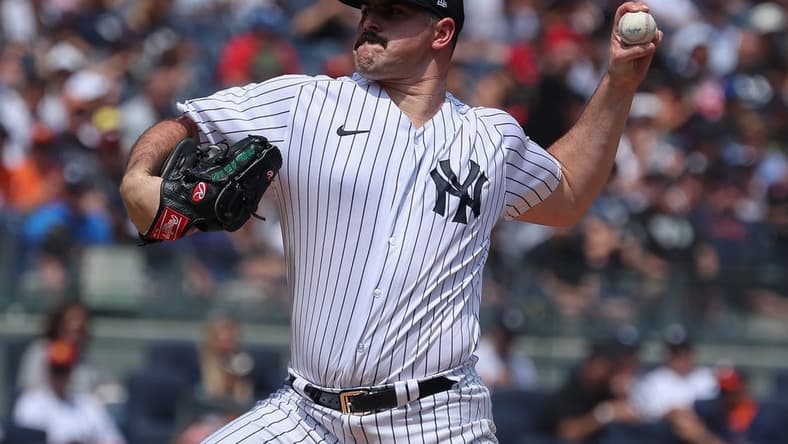 Aug 6, 2023; Bronx, New York, USA; New York Yankees starting pitcher Carlos Rodon (55) delivers a pitch during the first inning against the Houston Astros at Yankee Stadium. Mandatory Credit: Vincent Carchietta-USA TODAY Sports