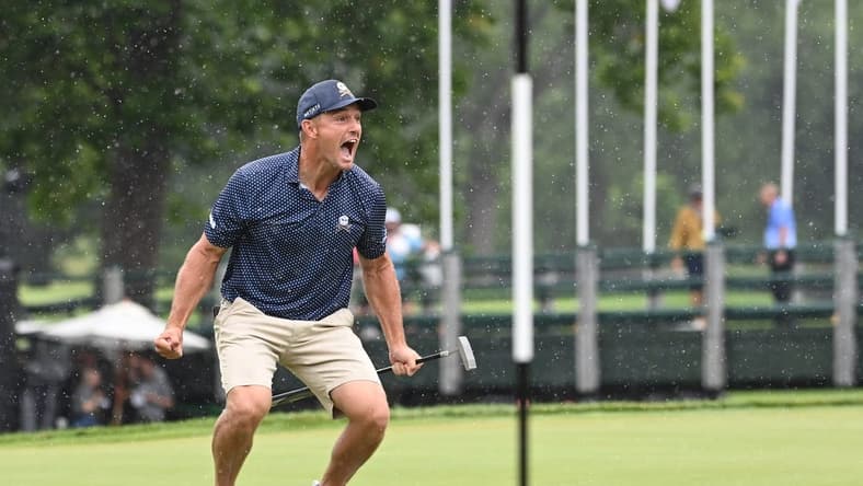 Aug 6, 2023; White Sulphur Springs, West Virginia, USA; Bryson DeChambeau celebrates after hitting a birdie putt on 18 and shooting a record 58 during the final round of the LIV Golf event at The Old White Course. Mandatory Credit: Bob Donnan-USA TODAY Sports