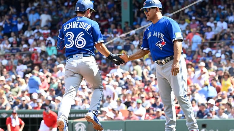 Aug 6, 2023; Boston, Massachusetts, USA; Toronto Blue Jays second baseman Davis Schneider (36) celebrates a two run home run against the Boston Red Sox with third base coach Luis Rivera (20) in the fourth inning at Fenway Park. Mandatory Credit: Eric Canha-USA TODAY Sports