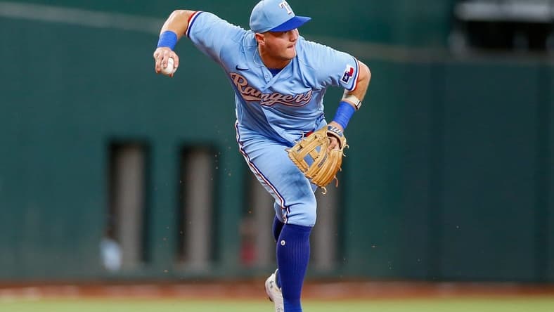 Aug 6, 2023; Arlington, Texas, USA; Texas Rangers third baseman Josh Jung (6) fields a ground ball during the first inning against the Miami Marlins at Globe Life Field. Mandatory Credit: Andrew Dieb-USA TODAY Sports