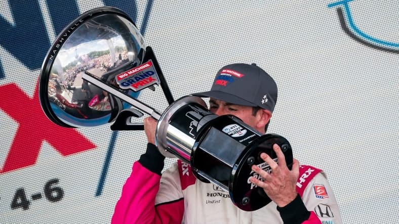 NTT IndyCar Series driver Kyle Kirkwood celebrates winning the Music City Grand Prix in Nashville, Tenn., Sunday, Aug. 6, 2023.
