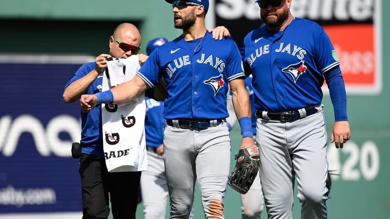 Aug 6, 2023; Boston, Massachusetts, USA; Toronto Blue Jays center fielder Kevin Kiermaier (39) gets medical attention to his left arm during the sixth inning against the Boston Red Sox at Fenway Park. Mandatory Credit: Eric Canha-USA TODAY Sports