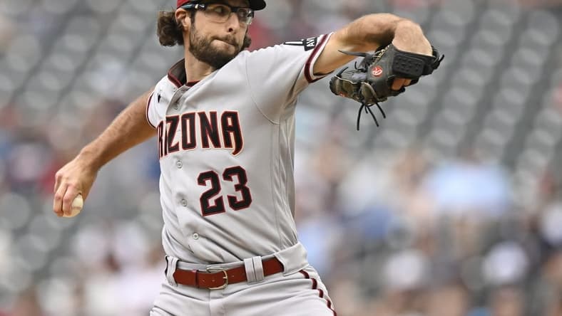 Aug 6, 2023; Minneapolis, Minnesota, USA; Arizona Diamondbacks pitcher Zac Gallen (23) delivers a pitch against the Minnesota Twins during the second inning at Target Field. Mandatory Credit: Nick Wosika-USA TODAY Sports