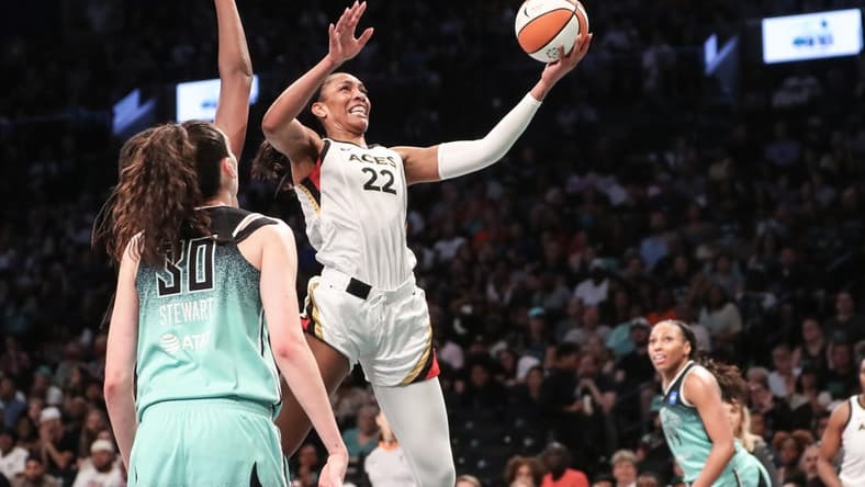 Aug 6, 2023; Brooklyn, New York, USA; Las Vegas Aces forward A'ja Wilson (22) drives to the basket in the third quarter against the New York Liberty at Barclays Center. Mandatory Credit: Wendell Cruz-USA TODAY Sports