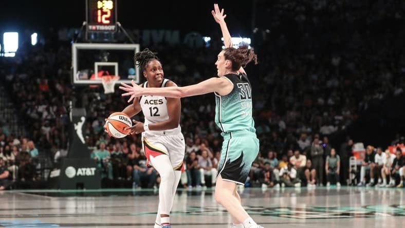 Aug 6, 2023; Brooklyn, New York, USA; Las Vegas Aces guard Chelsea Gray (12) is guarded by New York Liberty forward Breanna Stewart (30) in the third quarter at Barclays Center. Mandatory Credit: Wendell Cruz-USA TODAY Sports