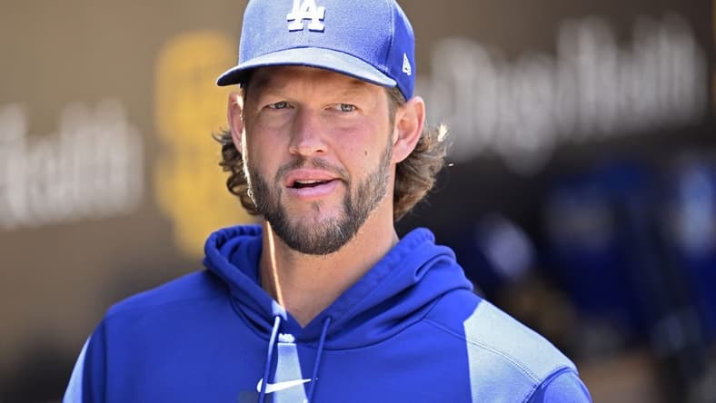Aug 7, 2023; San Diego, California, USA; Los Angeles Dodgers pitcher Clayton Kershaw (22) looks on from the dugout before the game against the San Diego Padres at Petco Park. Mandatory Credit: Orlando Ramirez-USA TODAY Sports
