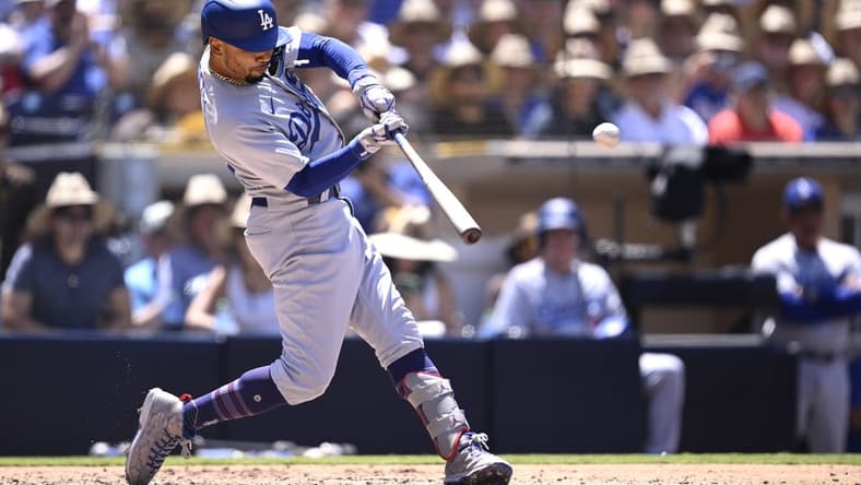 Aug 7, 2023; San Diego, California, USA; Los Angeles Dodgers second baseman Mookie Betts (50) hits a grand slam home run during the fourth inning against the San Diego Padres at Petco Park. Mandatory Credit: Orlando Ramirez-USA TODAY Sports