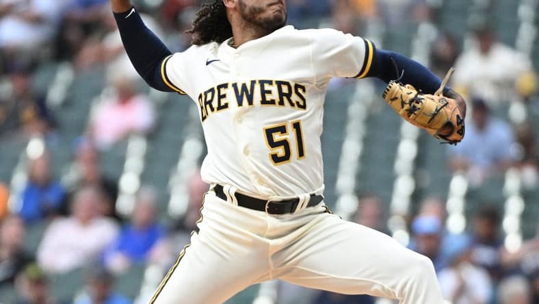 Aug 7, 2023; Milwaukee, Wisconsin, USA; Milwaukee Brewers starting pitcher Freddy Peralta (51) delivers a pitch against the Colorado Rockies in the first inning at American Family Field. Mandatory Credit: Michael McLoone-USA TODAY Sports
