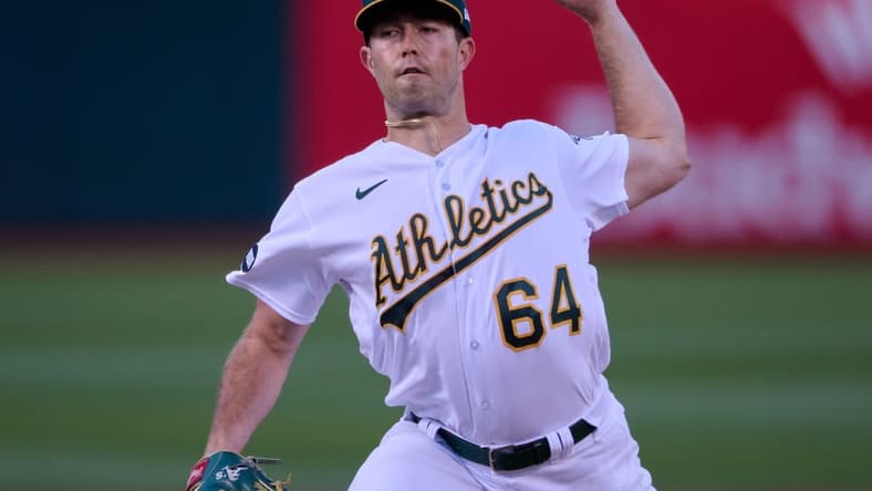 Aug 7, 2023; Oakland, California, USA; Oakland Athletics starting pitcher Ken Waldichuk (64) throws a pitch against the Texas Rangers during the first inning at Oakland-Alameda County Coliseum. Mandatory Credit: Robert Edwards-USA TODAY Sports
