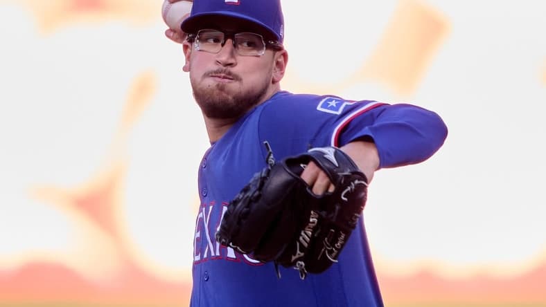 Aug 7, 2023; Oakland, California, USA; Texas Rangers starting pitcher Dane Dunning (33) throws a pitch against the Oakland Athletics during the first inning at Oakland-Alameda County Coliseum. Mandatory Credit: Robert Edwards-USA TODAY Sports