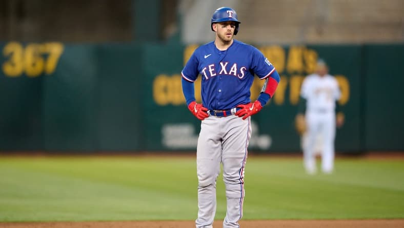 Aug 7, 2023; Oakland, California, USA; Texas Rangers catcher Mitch Garver (18) stands on second base after hitting his second double of the game against the Oakland Athletics during the sixth inning at Oakland-Alameda County Coliseum. Mandatory Credit: Robert Edwards-USA TODAY Sports