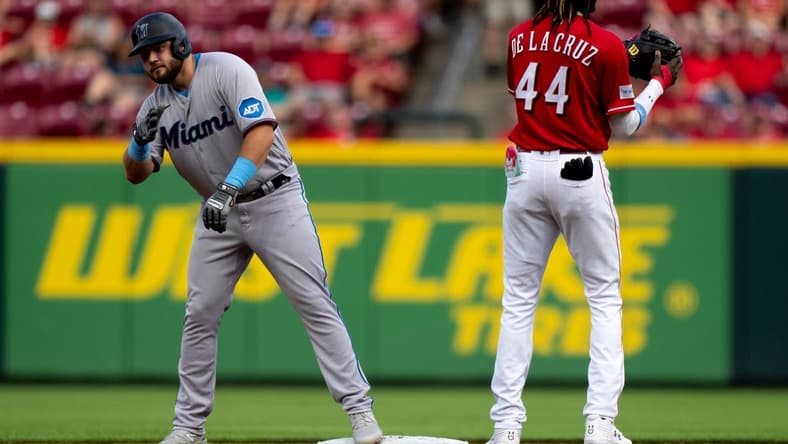 Miami Marlins third baseman Jake Burger (36) jesters to the dugout after hitting a double in the second inning of the MLB baseball game between Cincinnati Reds and Miami Marlins at Great American Ball Park in Cincinnati on Tuesday, Aug. 8, 2023.