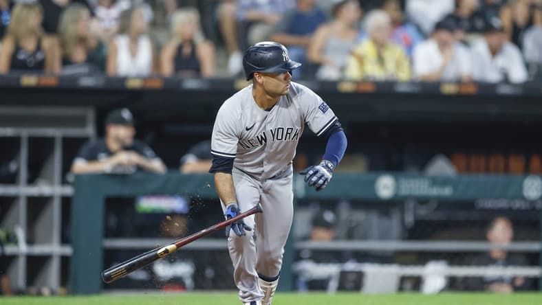 Aug 8, 2023; Chicago, Illinois, USA; New York Yankees center fielder Isiah Kiner-Falefa (12) watches his two-run double against the Chicago White Sox during the fourth inning at Guaranteed Rate Field. Mandatory Credit: Kamil Krzaczynski-USA TODAY Sports