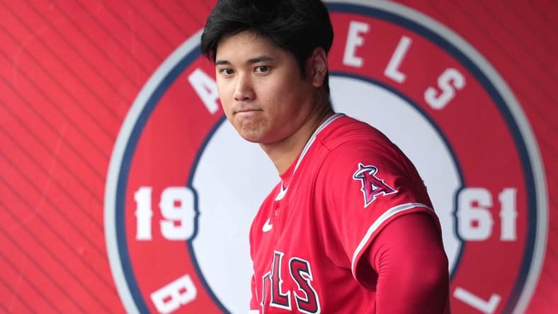 Aug 8, 2023; Anaheim, California, USA; Los Angeles Angels designated hitter Shohei Ohtani (17) watches from the dugout in the first inning against the San Francisco Giants at Angel Stadium. Mandatory Credit: Kirby Lee-USA TODAY Sports