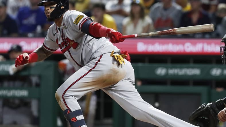 Aug 8, 2023; Pittsburgh, Pennsylvania, USA;  Atlanta Braves shortstop Orlando Arcia (11) hits a game winning two-run double against the Pittsburgh Pirates during the ninth inning at PNC Park. Atlanta won 8-6. Mandatory Credit: Charles LeClaire-USA TODAY Sports