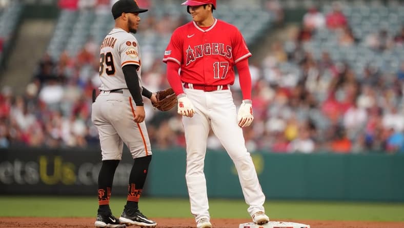 Aug 8, 2023; Anaheim, California, USA; Los Angeles Angels designated hitter Shohei Ohtani (17) talks with San Francisco Giants second baseman Thairo Estrada (39)
in the first inning at Angel Stadium. Mandatory Credit: Kirby Lee-USA TODAY Sports