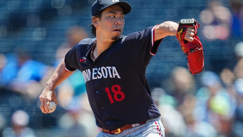 Jul 30, 2023; Kansas City, Missouri, USA; Minnesota Twins starting pitcher Kenta Maeda (18) pitches during the first inning against the Kansas City Royals at Kauffman Stadium. Mandatory Credit: Jay Biggerstaff-USA TODAY Sports