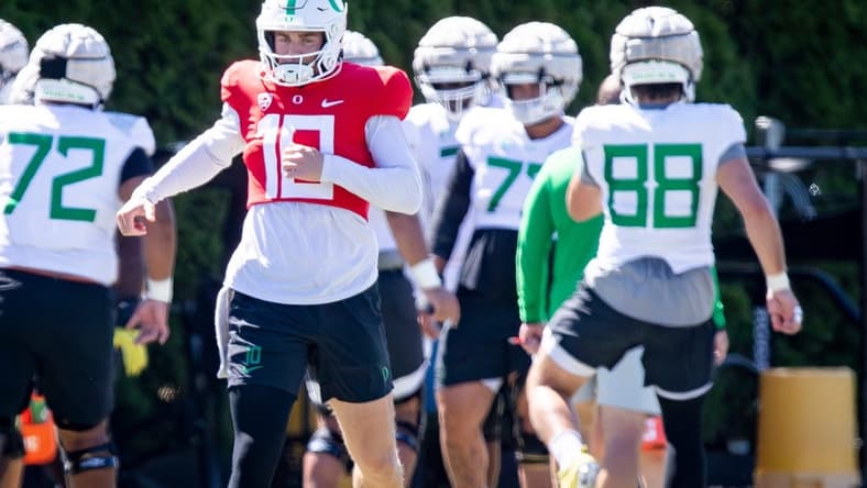 Oregon quarterback Bo Nix works out with the Ducks during practice Wednesday, Aug. 9, 2023 in Eugene.