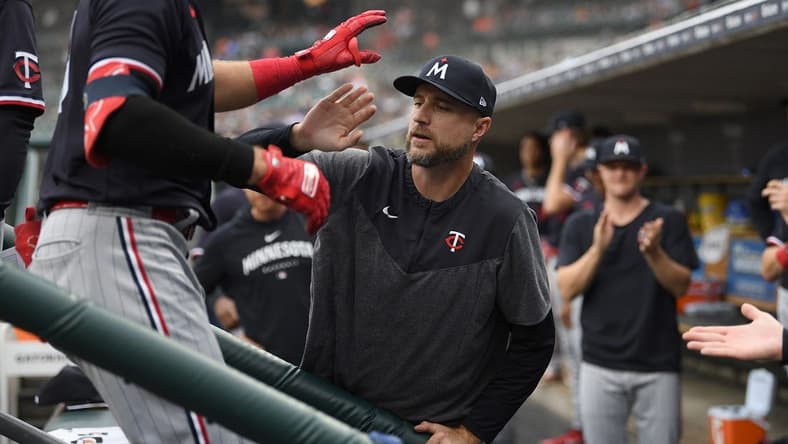 Aug 9, 2023; Detroit, Michigan, USA;  Minnesota Twins first baseman Joey Gallo (13) is congratulated on the dug out steps by manager Rocco Baldelli (5) after hitting a two run home run off Detroit Tigers starting pitcher Alex Faedo (49) (not pictured)  in the second inning at Comerica Park. Mandatory Credit: Lon Horwedel-USA TODAY Sports