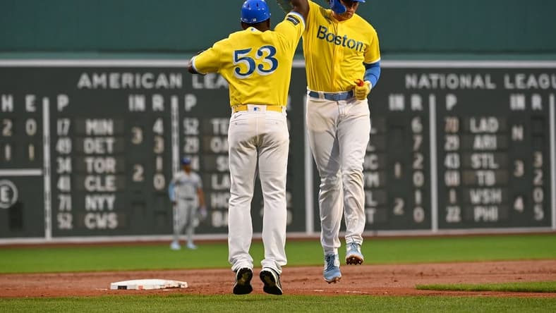 Aug 9, 2023; Boston, Massachusetts, USA;Boston Red Sox first baseman Triston Casas (36) celebrates his home run against the Kansas City Royals with third base coach Carlos Febles (53)  during the second inning at Fenway Park. Mandatory Credit: Eric Canha-USA TODAY Sports