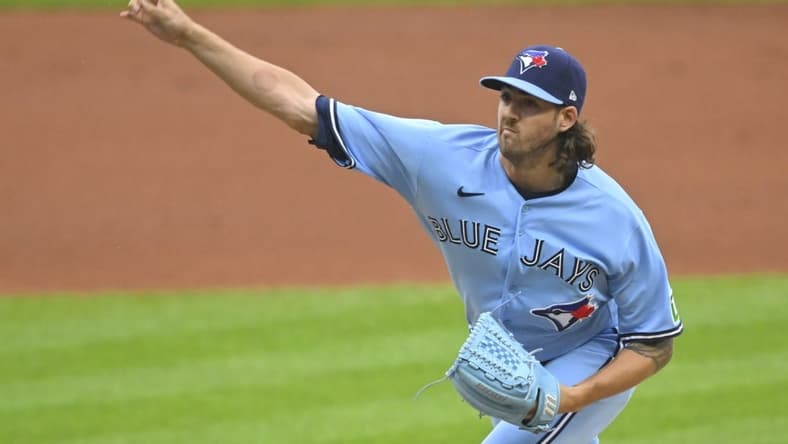 Aug 9, 2023; Cleveland, Ohio, USA; Toronto Blue Jays starting pitcher Kevin Gausman (34) delivers a pitch in the first inning against the Cleveland Guardians at Progressive Field. Mandatory Credit: David Richard-USA TODAY Sports