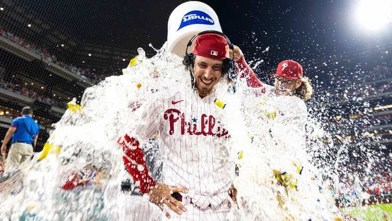 Aug 9, 2023; Philadelphia, Pennsylvania, USA; Philadelphia Phillies starting pitcher Michael Lorenzen (22) is doused with water by first baseman Alec Bohm (28) after pitching a no hit victory against the Washington Nationals at Citizens Bank Park. Mandatory Credit: Bill Streicher-USA TODAY Sports