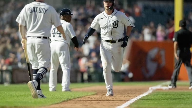 Aug 9, 2023; Detroit, Michigan, USA;  Detroit Tigers first baseman Spencer Torkelson (20) reaches home after hitting his second home run of the game against the Minnesota Twins in the seventh inning at Comerica Park. Mandatory Credit: Lon Horwedel-USA TODAY Sports