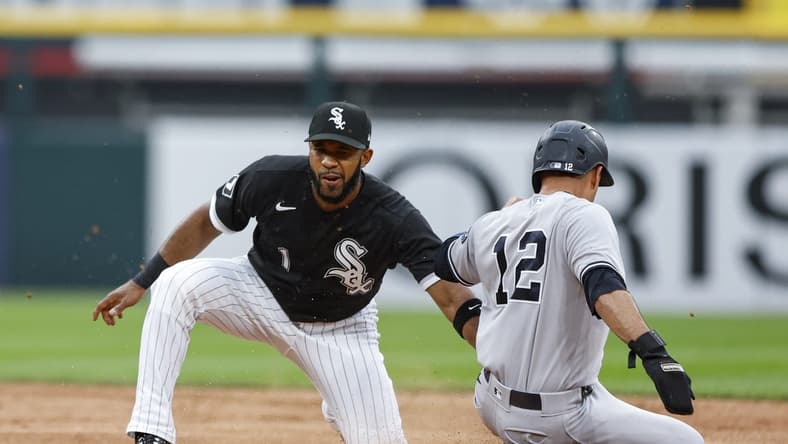 Aug 9, 2023; Chicago, Illinois, USA; New York Yankees center fielder Isiah Kiner-Falefa (12) is caught stealing second base by Chicago White Sox shortstop Elvis Andrus (1) during the second inning at Guaranteed Rate Field. Mandatory Credit: Kamil Krzaczynski-USA TODAY Sports