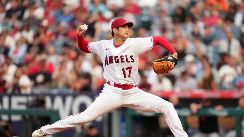 Aug 9, 2023; Anaheim, California, USA; Los Angeles Angels starting pitcher Shohei Ohtani (17) throws in the first inning against the San Francisco Giants at Angel Stadium. Mandatory Credit: Kirby Lee-USA TODAY Sports