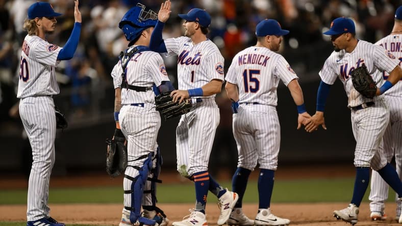 Aug 9, 2023; New York City, New York, USA; New York Mets second baseman Jeff McNeil (1) high fives teammates after defeating the Chicago Cubs at Citi Field. Mandatory Credit: John Jones-USA TODAY Sports