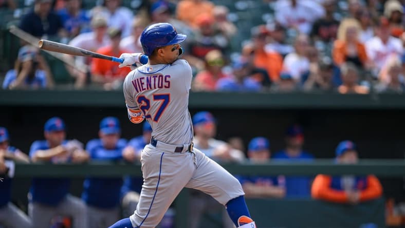 Aug 6, 2023; Baltimore, Maryland, USA; New York Mets third baseman Mark Vientos (27) hits a double during the ninth inning against the Baltimore Orioles at Oriole Park at Camden Yards. Mandatory Credit: Reggie Hildred-USA TODAY Sports
