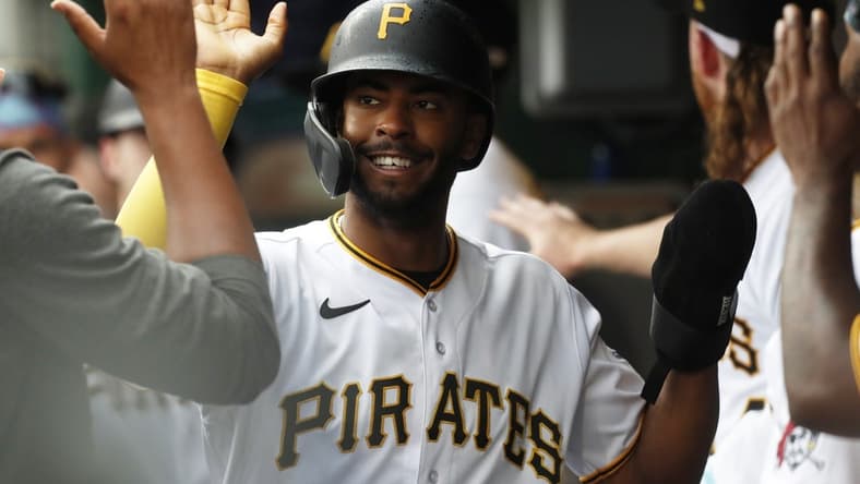 Aug 10, 2023; Pittsburgh, Pennsylvania, USA; Pittsburgh Pirates left fielder Josh Palacios (54) high-fives in the dugout after scoring a run against the Atlanta Braves during the third inning at PNC Park. Mandatory Credit: Charles LeClaire-USA TODAY Sports