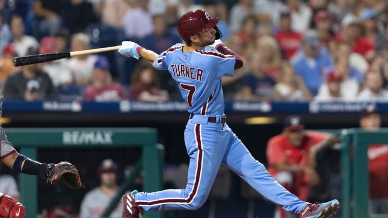 Aug 10, 2023; Philadelphia, Pennsylvania, USA; Philadelphia Phillies shortstop Trea Turner (7) hits a two RBI home run during the sixth inning against the Washington Nationals at Citizens Bank Park. Mandatory Credit: Bill Streicher-USA TODAY Sports