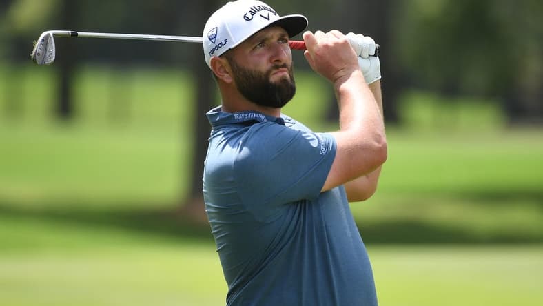 Aug 11, 2023; Memphis, Tennessee, USA; Jon Rahm watches his second shot on the ninth hole during the second round of the FedEx St. Jude Championship golf tournament. Mandatory Credit: Christopher Hanewinckel-USA TODAY Sports