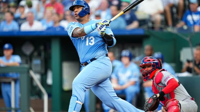 Aug 11, 2023; Kansas City, Missouri, USA; Kansas City Royals catcher Salvador Perez (13) hits an RBI double against the St. Louis Cardinals during the first inning at Kauffman Stadium. Mandatory Credit: Jay Biggerstaff-USA TODAY Sports