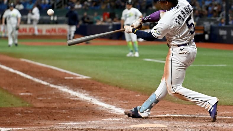 Aug 11, 2023; St. Petersburg, Florida, USA; Tampa Bay Rays shortstop Wander Franco (5) hits a walk off home run in the ninth inning against the Cleveland Guardians at Tropicana Field. Mandatory Credit: Jonathan Dyer-USA TODAY Sports