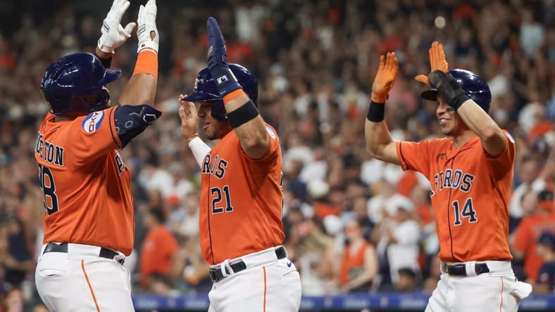 Aug 11, 2023; Houston, Texas, USA; Houston Astros first baseman Jon Singleton (28) celebrates his three run home run with designated hitter Yainer Diaz (21) and  center fielder Mauricio Dubon (14) in the second inning at Minute Maid Park. Mandatory Credit: Thomas Shea-USA TODAY Sports