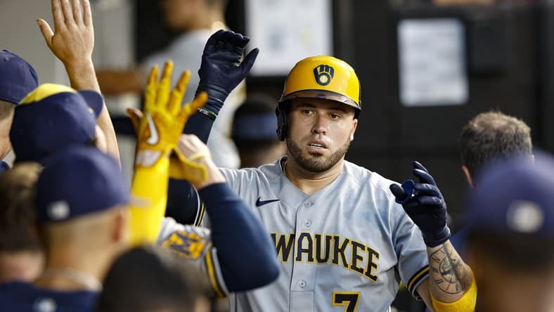 Aug 11, 2023; Chicago, Illinois, USA; Milwaukee Brewers catcher Victor Caratini (7) celebrates with teammates after scoring against the Chicago White Sox during the second inning at Guaranteed Rate Field. Mandatory Credit: Kamil Krzaczynski-USA TODAY Sports