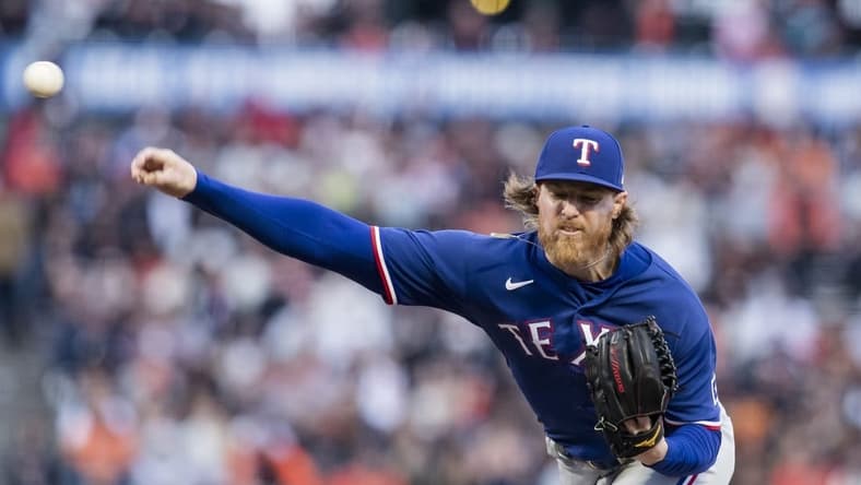 Aug 11, 2023; San Francisco, California, USA; Texas Rangers starting pitcher Jon Gray (22) throws against the San Francisco Giants during the first inning at Oracle Park. Mandatory Credit: John Hefti-USA TODAY Sports