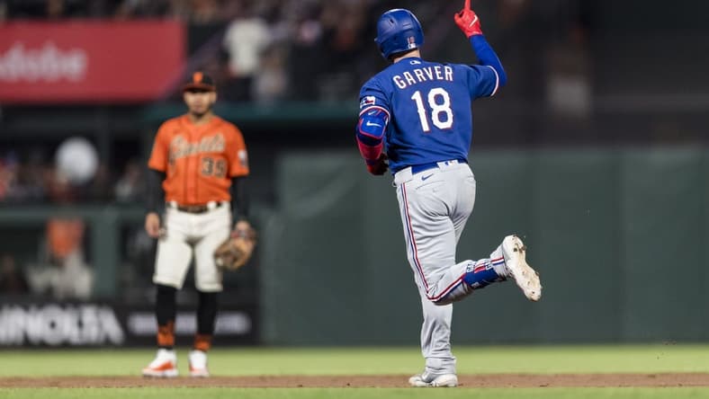 Aug 11, 2023; San Francisco, California, USA; Texas Rangers catcher Mitch Garver (18) runs the bases after hitting a solo home run against the San Francisco Giants during the sixth inning at Oracle Park. Mandatory Credit: John Hefti-USA TODAY Sports