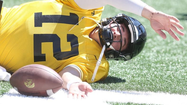 Iowa quarterback Cade McNamara warms up before scrimmaging during Kids' Day at Kinnick at Kinnick Stadium on Saturday, Aug. 12, 2023, in Iowa City, Iowa