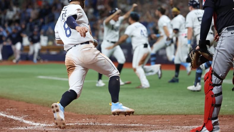 Aug 12, 2023; St. Petersburg, Florida, USA;  Tampa Bay Rays second baseman Brandon Lowe (8) scores the game winning run against the Cleveland Guardians during the ninth inning at Tropicana Field. Mandatory Credit: Kim Klement Neitzel-USA TODAY Sports
