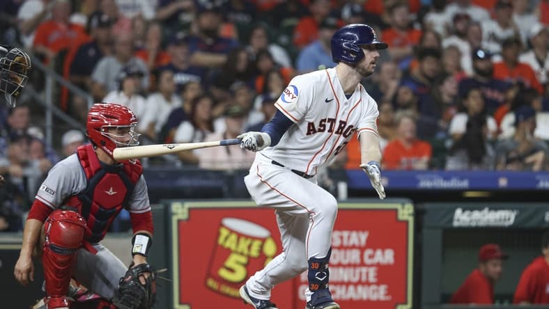 Aug 12, 2023; Houston, Texas, USA; Houston Astros right fielder Kyle Tucker (30) hits a single during the seventh inning against the Los Angeles Angels at Minute Maid Park. Mandatory Credit: Troy Taormina-USA TODAY Sports