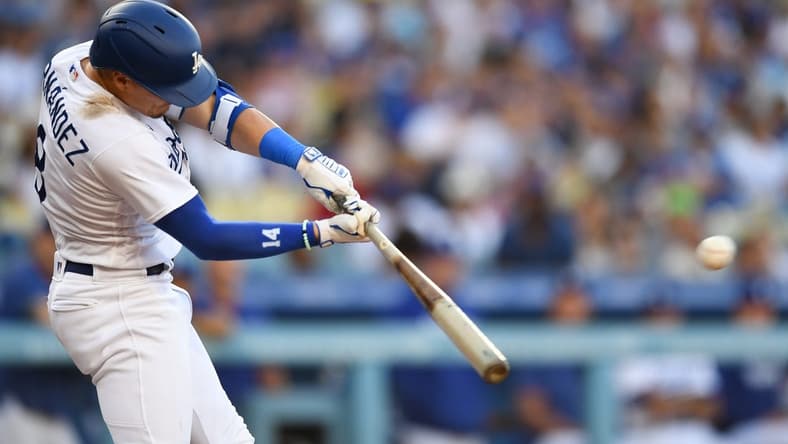 Aug 12, 2023; Los Angeles, California, USA; Los Angeles Dodgers shortstop Enrique Hernandez (8) doubles against the Colorado Rockies during the second inning at Dodger Stadium. Mandatory Credit: Jonathan Hui-USA TODAY Sports