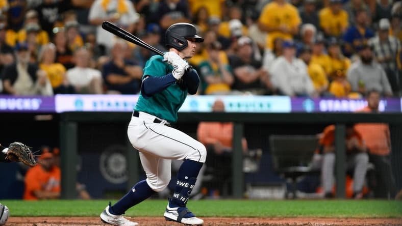 Aug 12, 2023; Seattle, Washington, USA; Seattle Mariners left fielder Cade Marlowe (18) hits a single against the Baltimore Orioles during the ninth inning at T-Mobile Park. Mandatory Credit: Steven Bisig-USA TODAY Sports