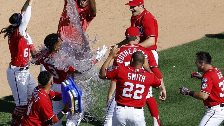 Aug 13, 2023; Washington, District of Columbia, USA; Washington Nationals second baseman Jeter Downs (3) celebrates with teammates after hitting a two run walk off single against the Oakland Athletics during the ninth inning at Nationals Park. Mandatory Credit: Geoff Burke-USA TODAY Sports