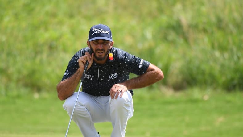 Aug 13, 2023; Memphis, Tennessee, USA; Max Homa lines up a putt on the first hole during the final round of the FedEx St. Jude Championship golf tournament. Mandatory Credit: Christopher Hanewinckel-USA TODAY Sports