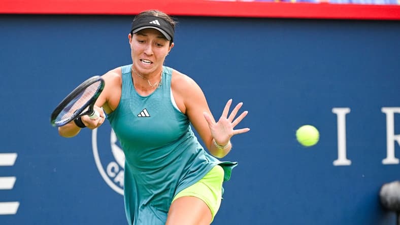 Aug 13, 2023; Montreal, Quebec, Canada; Jessica Pegula (USA) returns the ball against Liudmila Samsonova (not pictured) during singles final play at IGA Stadium. Mandatory Credit: David Kirouac-USA TODAY Sports