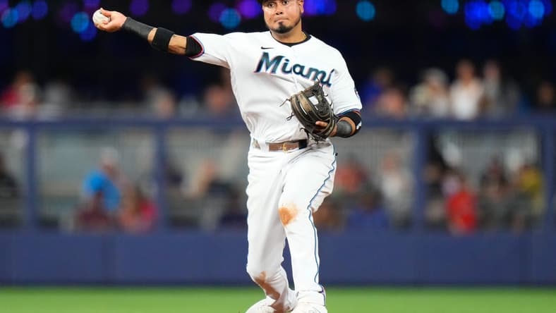 Aug 14, 2023; Miami, Florida, USA; Miami Marlins second baseman Luis Arraez (3) throws the ball to first base for an out against the Houston Astros during the fourth inning at loanDepot Park. Mandatory Credit: Rich Storry-USA TODAY Sports